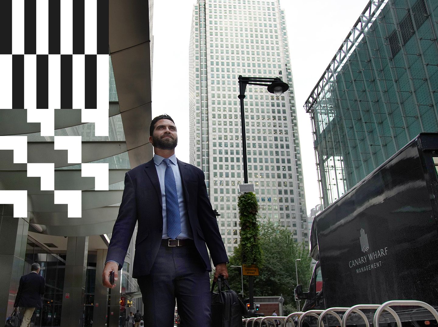 A City alumnus walking in Canary Wharf