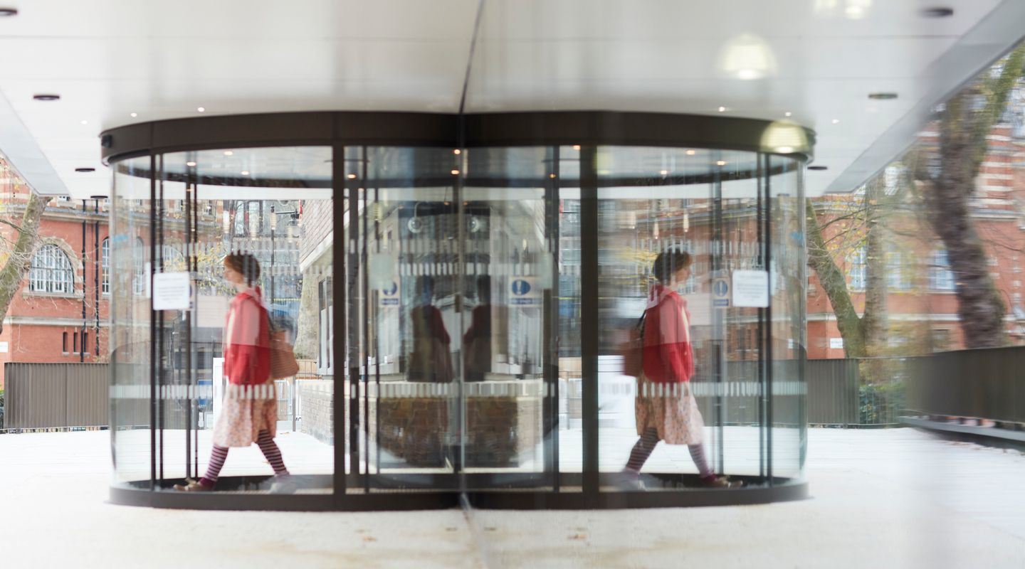 Person walking out from the entrance door. Credit: Laurie Griffith