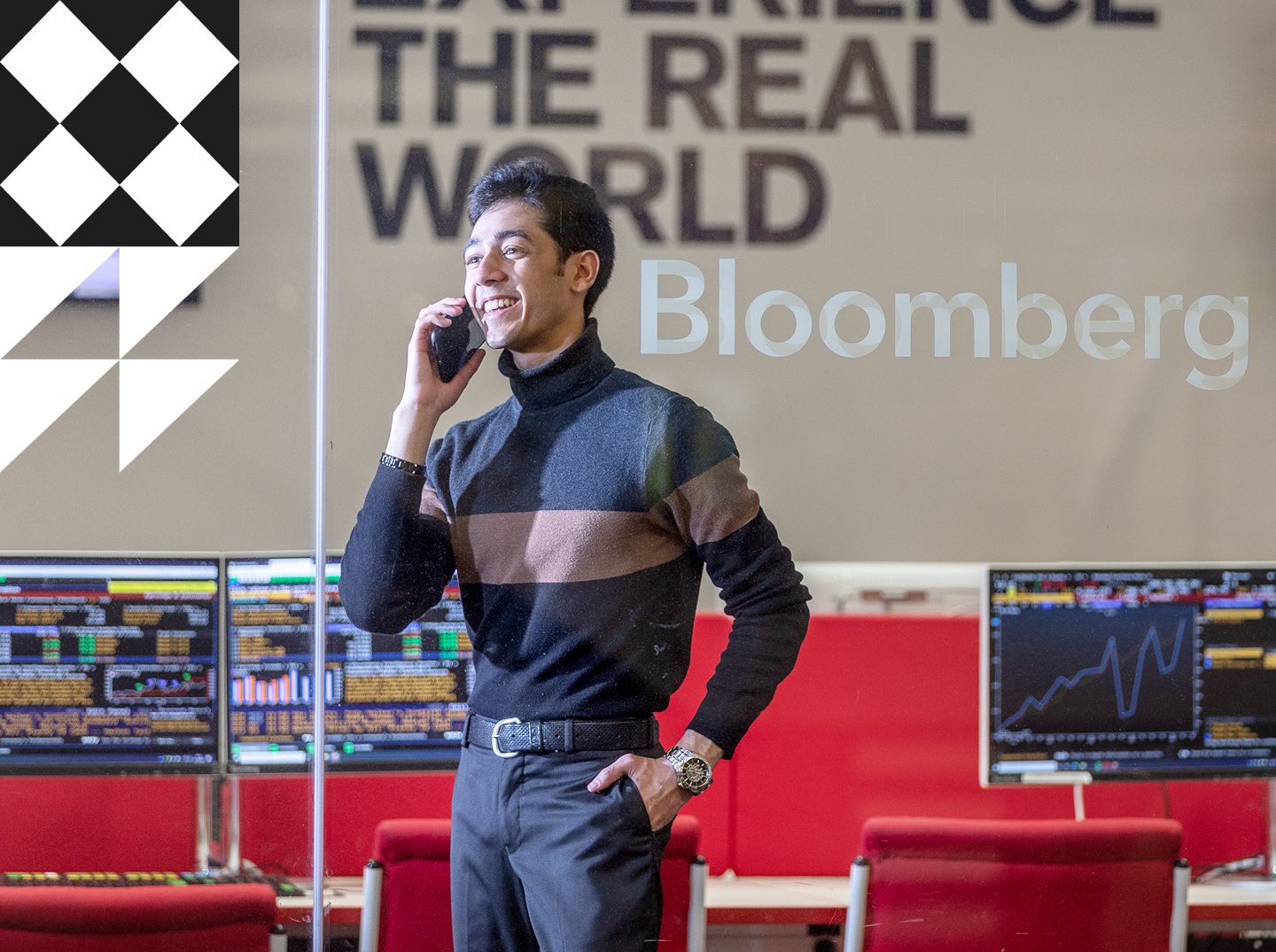 Male business student on the phone in the Bloomberg computer suite