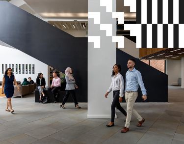 City students walking in the main entrance