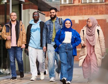 Students walking towards Rhind Building