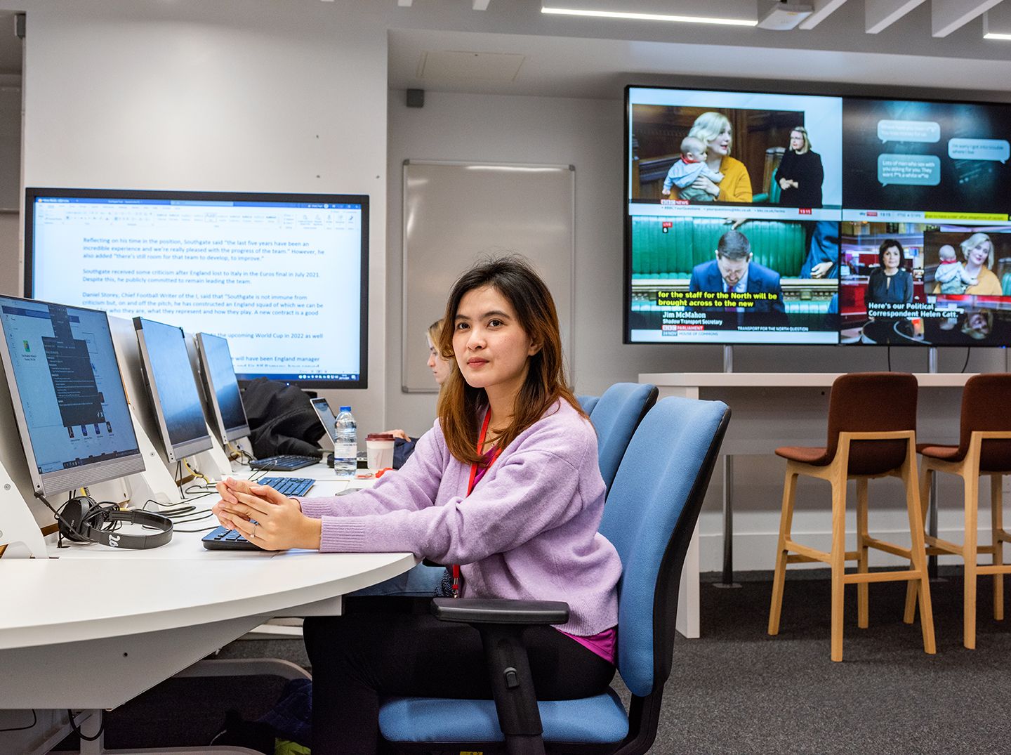 Female student sat in the multimedia suite