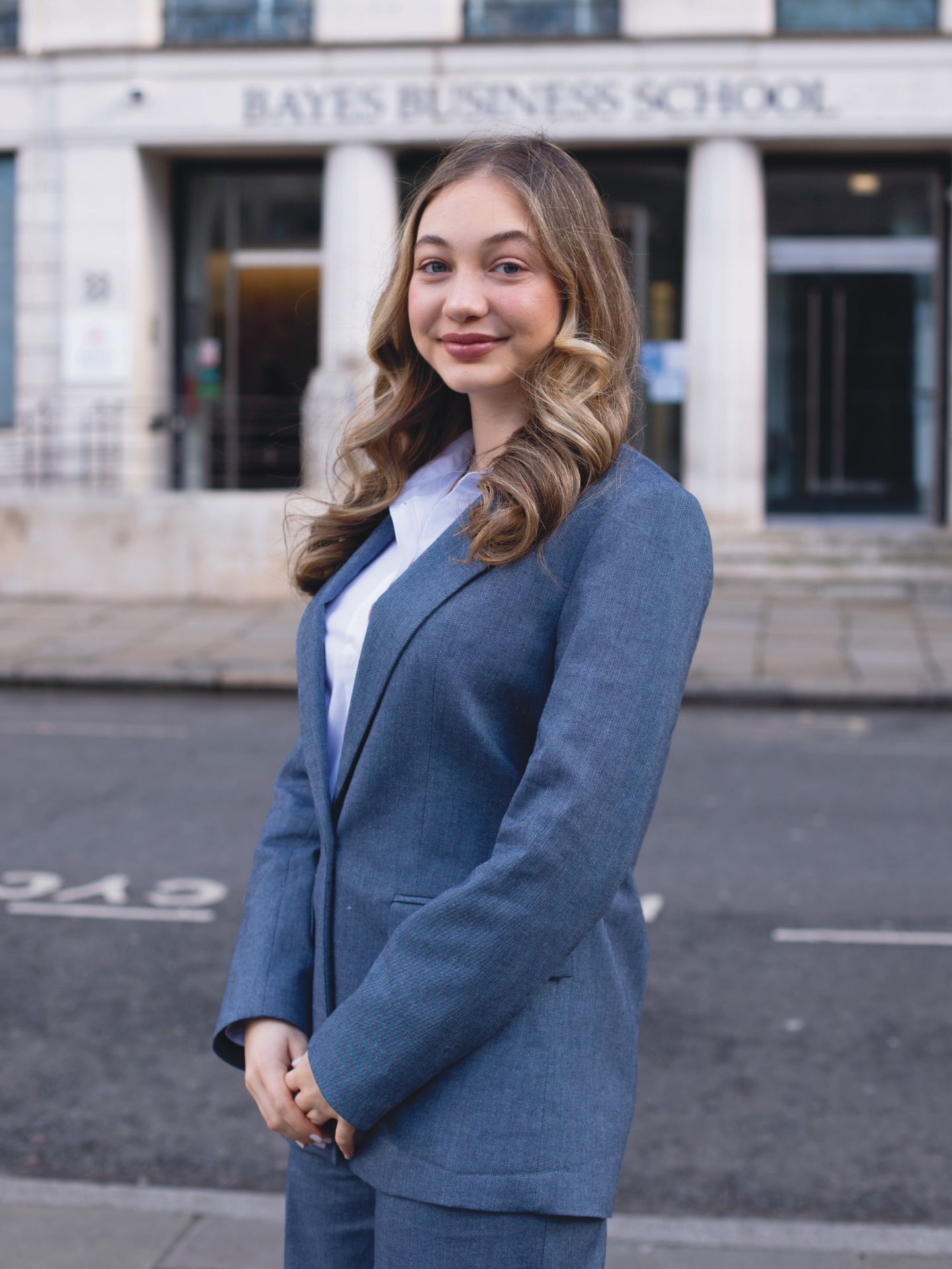 Student Sophie standing outside Bayes Business School
