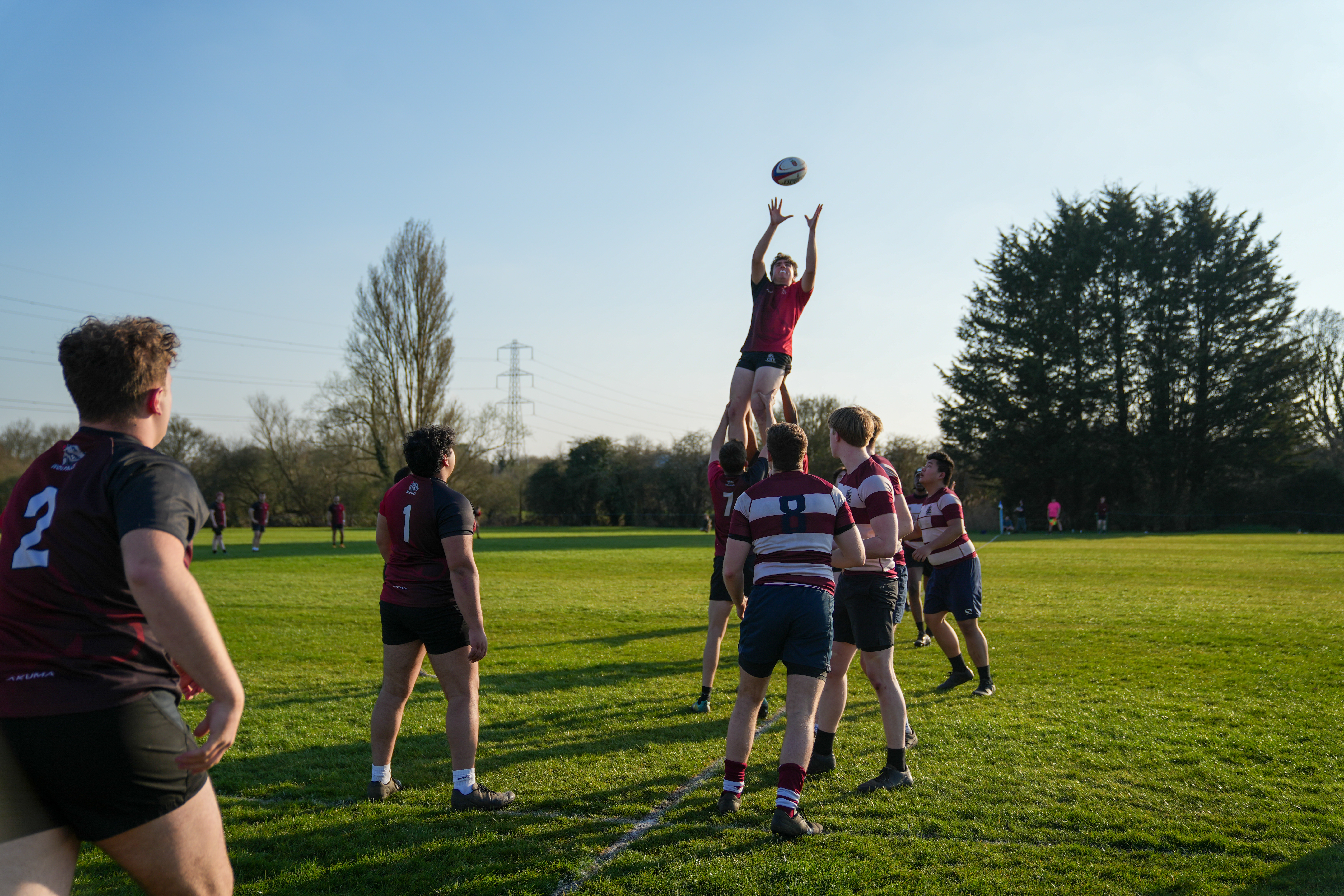 Man jumping to catch a rugby ball