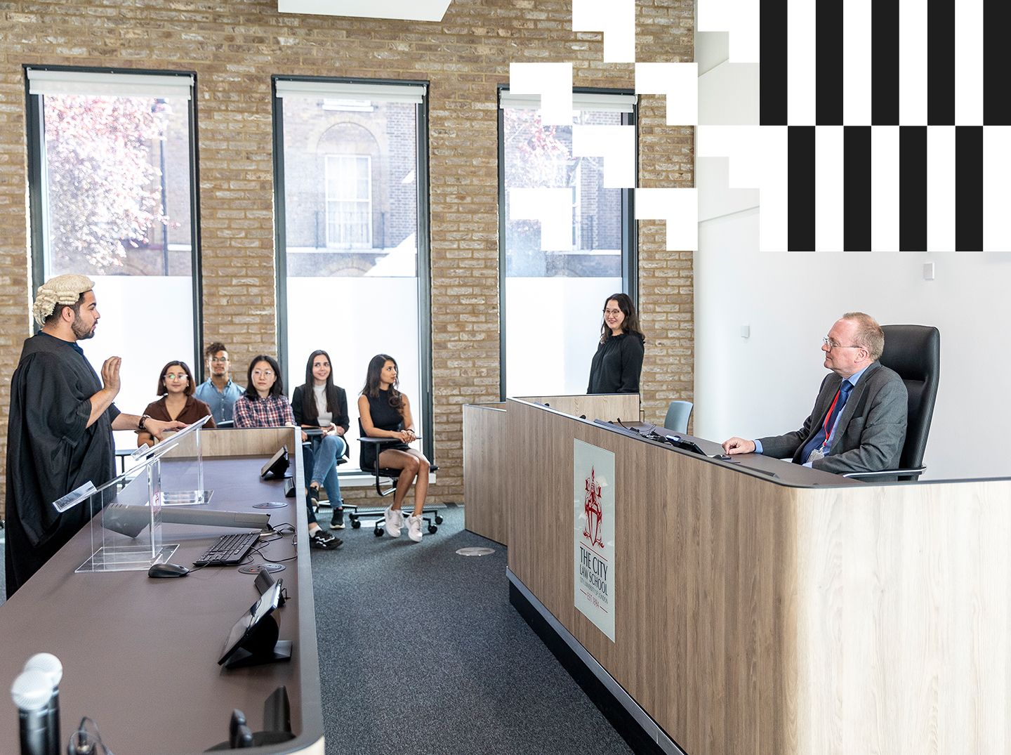 Academic and students in the mooting room