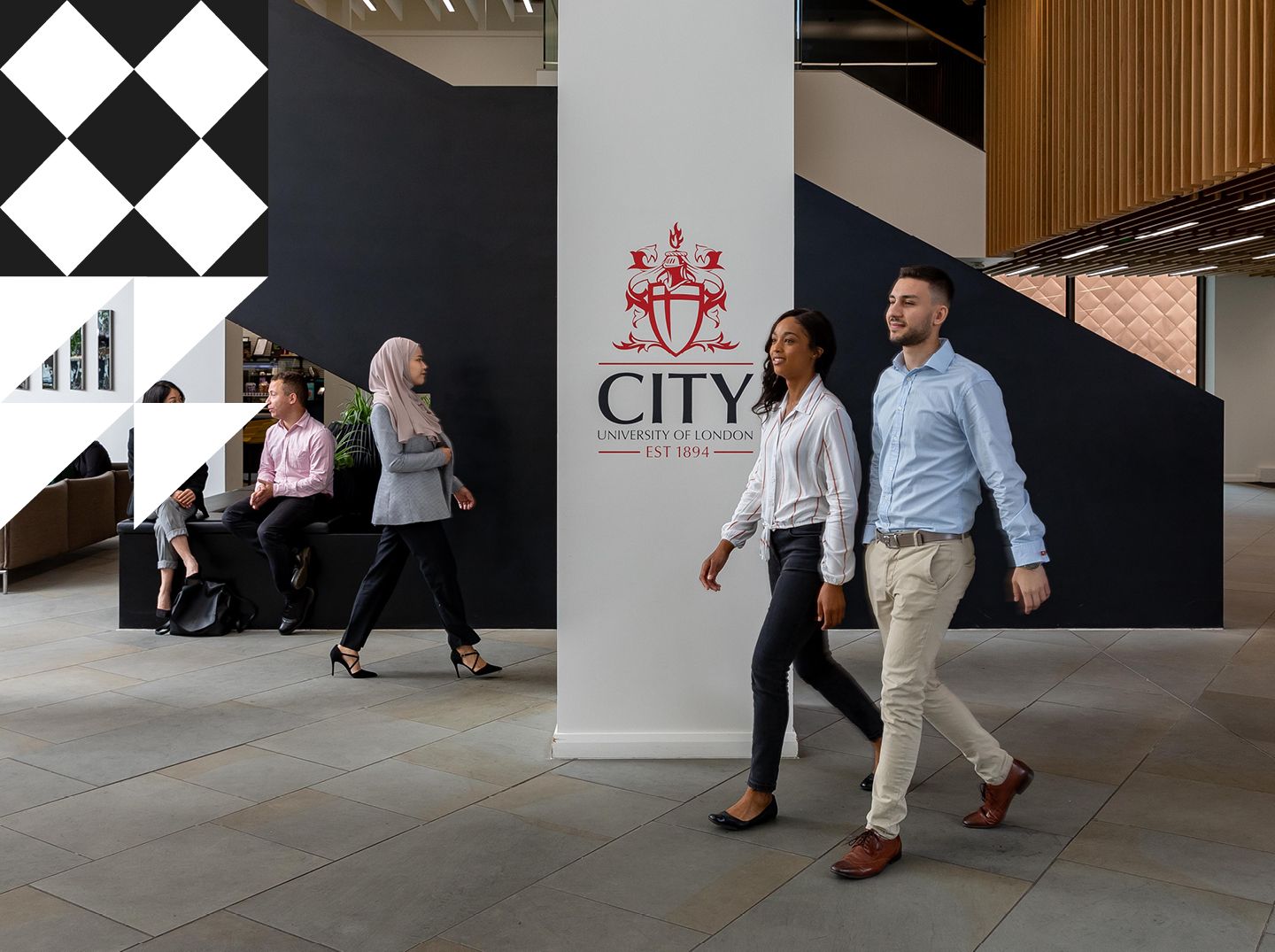 Students and staff walking in the Foyer at Northampton Square.