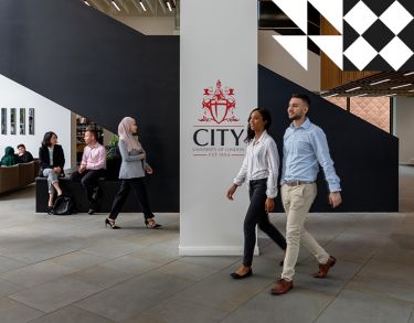 Students and staff walking in the Foyer at Northampton Square.