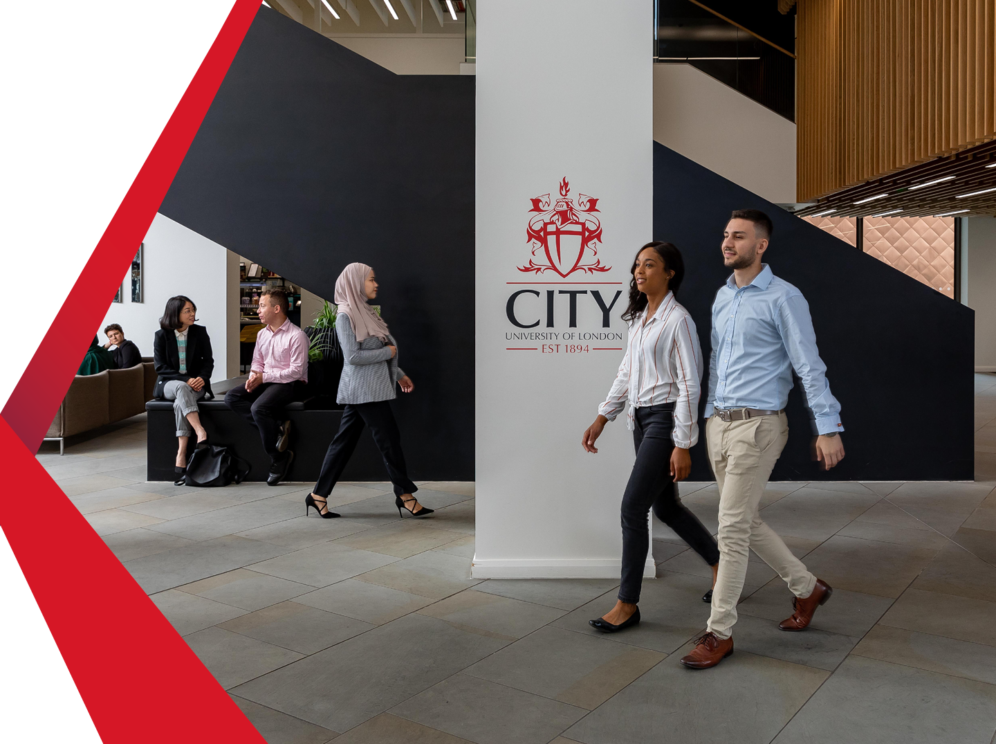 Students and staff walking in the Foyer at Northampton Square.