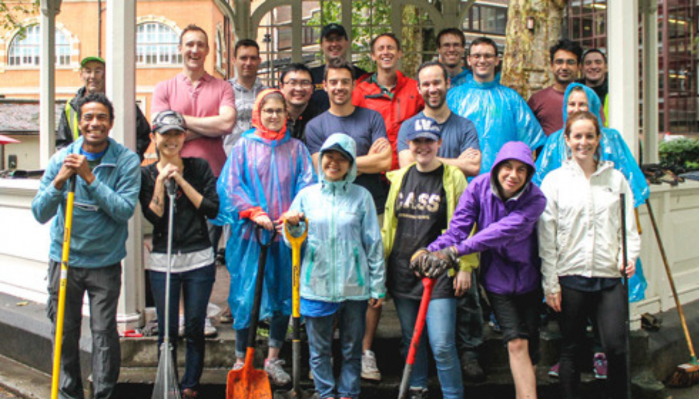 A large group of people ready to volunteer to do gardening