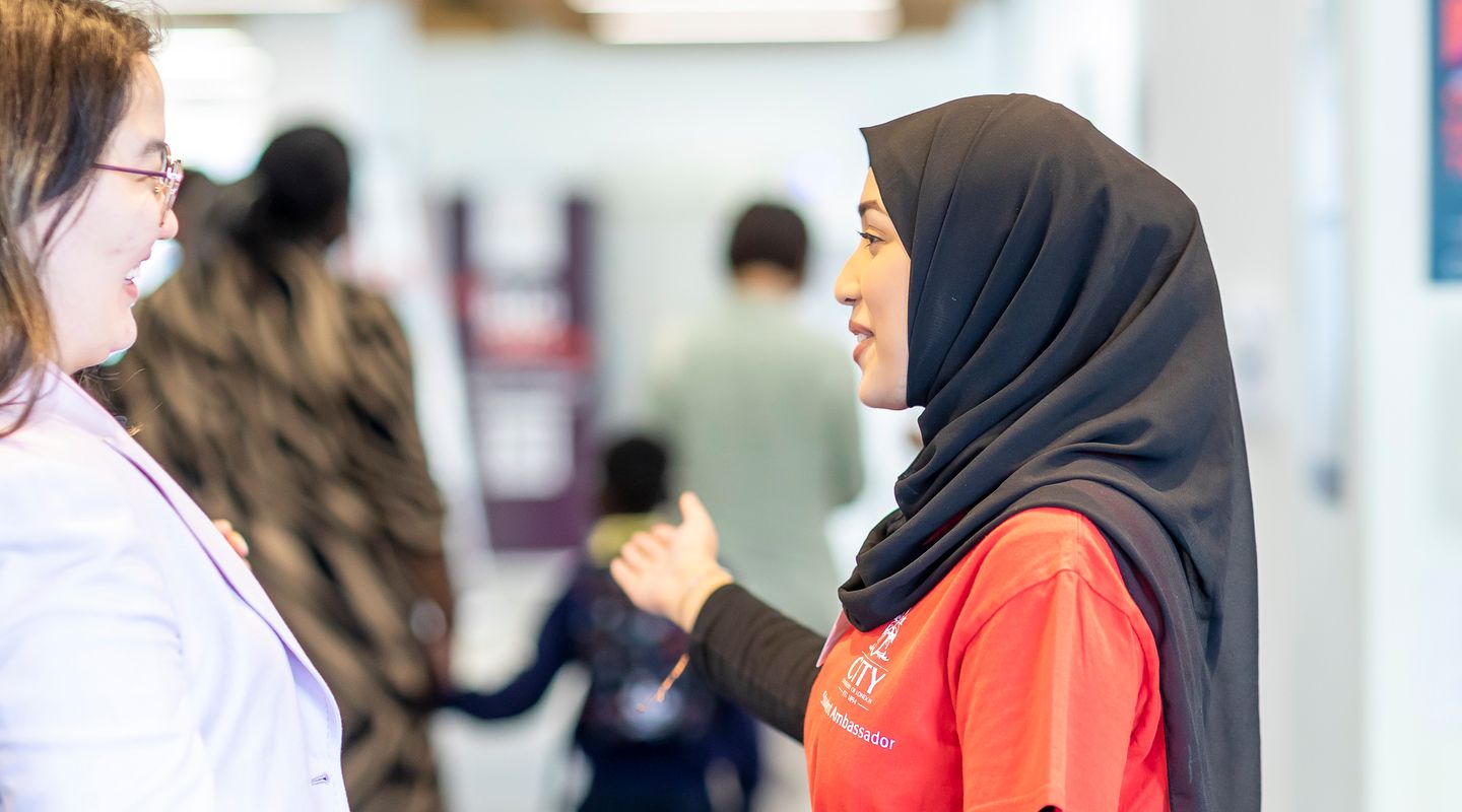Attendee welcomed by a City Ambassador