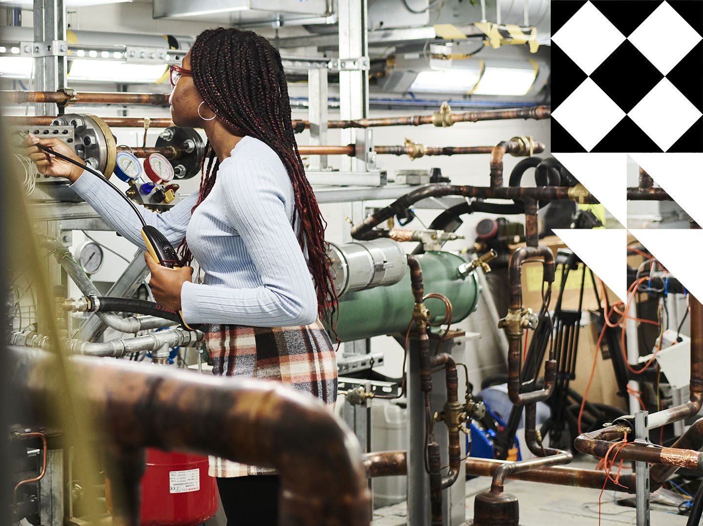 Young black woman working in an engineering lab.